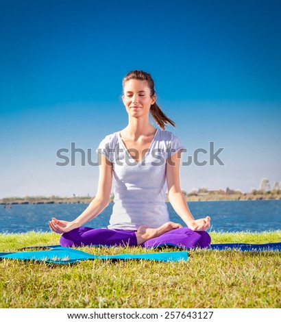 Beautiful young woman has a meditation on yoga class. Yoga concept.