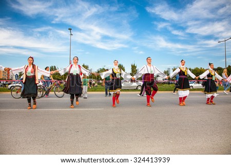 NOVI SAD, SERBIA-OCT 4, 2015: Guinness World Record Largest Folk Dance on Oct 4. 2015 in Novi Sad, Serbia. Over 12.000 participants break the Guinness World Record by simultaneously dancing a Kolo