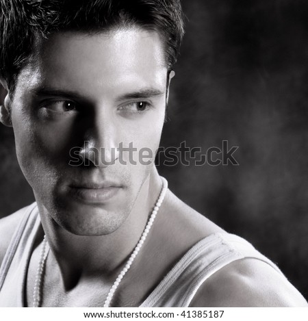 Black white Shot of a Young Man A trendy European man dressed in contemporary cloth. He is now a professional model.