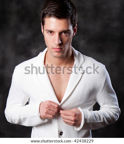 Fashion Shot of a Young Man. A trendy European man dressed in contemporary cloth. He is now a professional model.