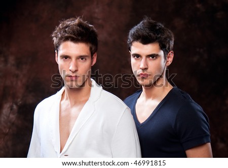 Fashion Shot of a trendy European men dressed in contemporary cloth. They are now a professional models.