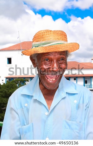 Old sympathetic cuban man with straw hat make a funny face, Santiago de Cuba, Cuba