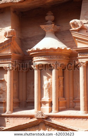 Detail of 3.5 m high urn in the middle of second level of Treasury (Al-Khazneh)  in ancient city of Petra in Jordan. It was carved out of a single rock. It is now an UNESCO World Heritage Site.