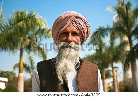 GWALIOR, INDIA -18 FEBRUARY: Old sikh man posing in front of Gwalior Fort complex, February 18, 2008. Gwalior, Madhya Pradesh, India