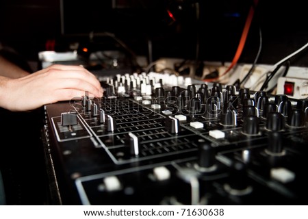 DJ is mixing music on music console. Music device. Element of design.