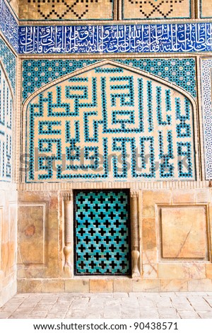Tiled oriental ornaments Ateegh Jame mosque\'s wall with window , Esfahan, Iran