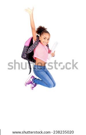 little girl at school jumping isolated in white