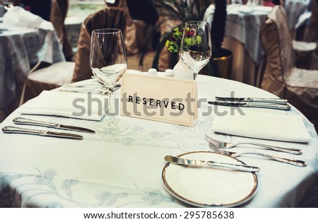 Reserved sign on the table in a fancy restaurant