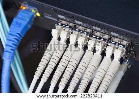 Optic fiber and SFP connected to switch.