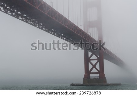 The Golden Gate Bridge disappears into the fog.