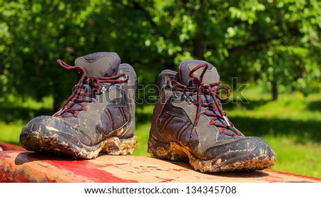 Pair of muddy boots outdoor