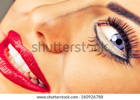 Closeup of young woman face with creative makeup