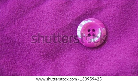Purple fabric texture with single round button