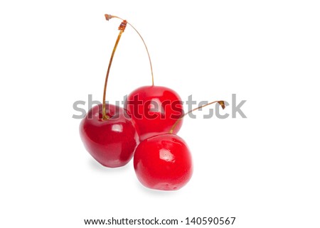 Three single cherries over white (with shadow)