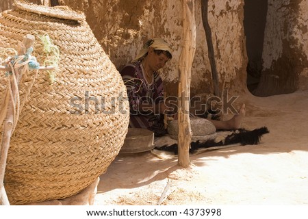 Traditional Arab woman in troglodyt house. Africa, Tunis