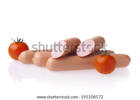 Fresh polish hot dog sausages and tomatoes. Meat composition taken on white background with reflection.