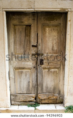 A beautiful architecture on island in Croatia. Old wooden door.