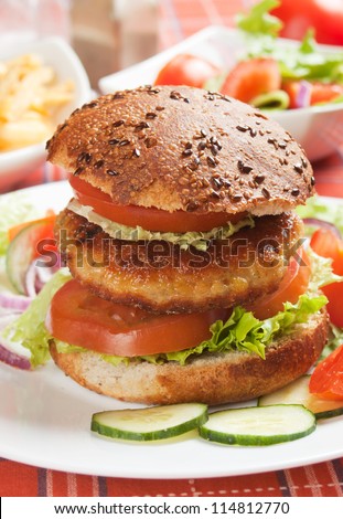 Healthy vegetarian soy burger with lettuce and tomato
