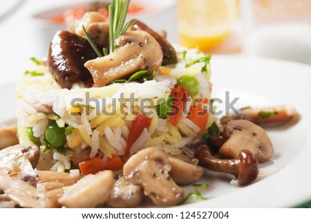 Risotto, cooked rice with mushrooms and vegetables