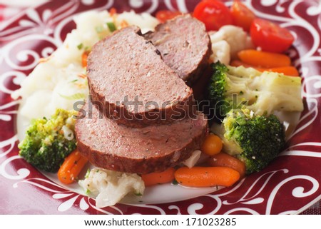 Meat loaf slices with cooked vegetables, traditional american cuisine
