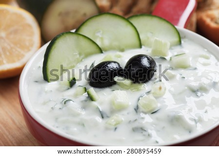 Tzatziki or cacik, cucumber and yogurt salad with black olives