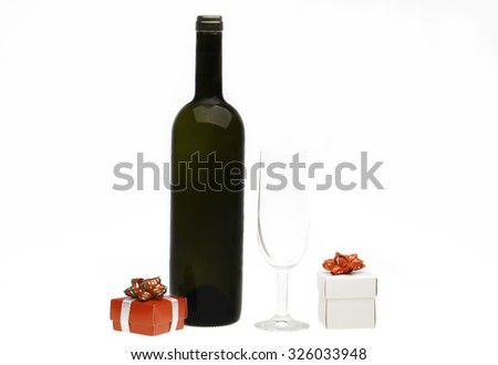 View bottle of white wine ,gift box and empty glass, isolated on white