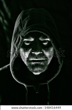 Dark portrait of scary evil sinister bearded man