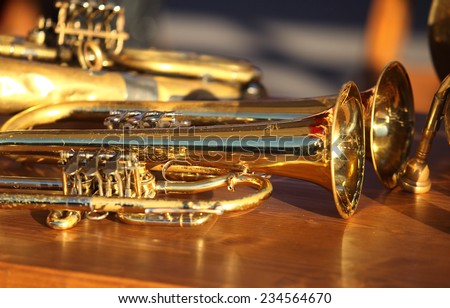 Blowing brass wind instrument on table
