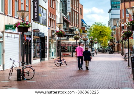 Eindhoven, Netherlands - May 24, 2015: People walking in the Eindhoven main commercial street. It is one of the most famous shopping street in the city with a plenty of stores, bars and clubs