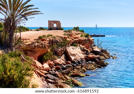 Rocky coastline of Punta Prima. Province of Alicante. Southern Spain Stockfoto © 