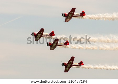 CHICAGO, IL - AUGUST 18: Aeroshell team of aerobatic planes maneuver their planes during airshow on Chicago Lakefront August 18, 2012 in Chicago, IL.