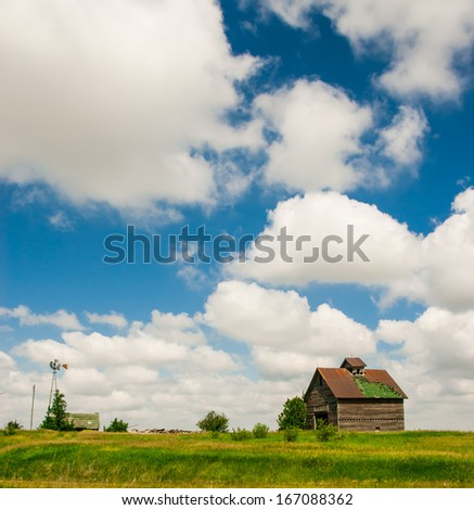 Log cabin in an old lonely rural cottage in a farm field
