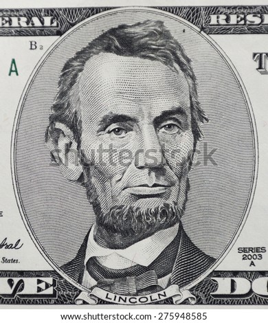 CHICAGO, ILLINOIS - APRIL 29, 2015. Macro shot of Abraham Lincoln the Five Dollar Currency banknote