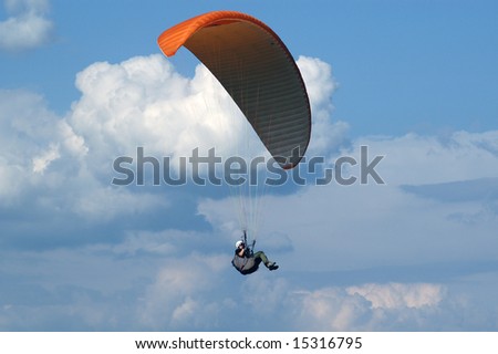 paragliding in cloudscape area