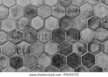 The black and white background image of hexagonal clay tiles