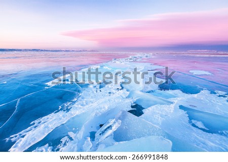 Ice-drift on Baikal lake at the sunset