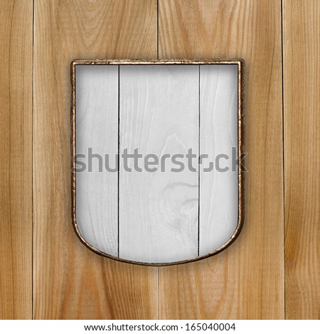 Wooden plaque in a metal frame on the background boards