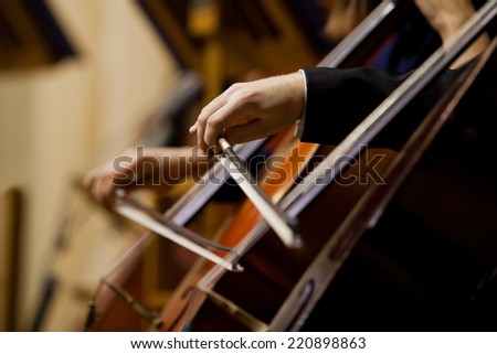 Hands of the man playing the cello