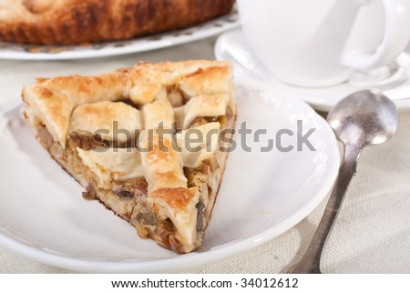piece of mushroom pie close up and coffee