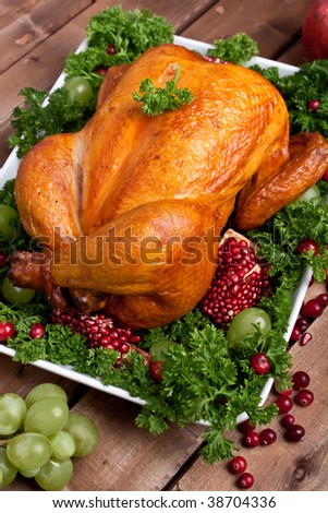 roasted chicken garnished with parsley and fruits