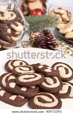 big pile of various cookies with pine cones and christmas toys
