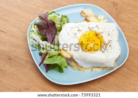 Serving of Croque Madame (Ham, Cheese and Fried Egg Sandwich)
