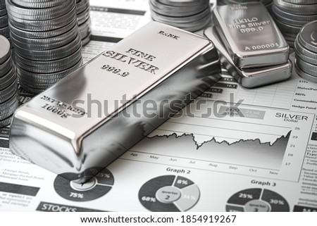 Silver bar, ingots and coins on financial  report. Growth of silver on stock market concept. 3d illustration