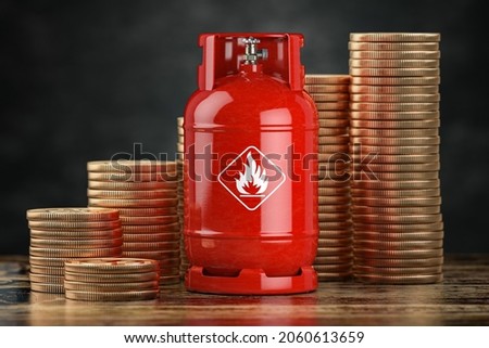 Gas bottle and stack of coins. Growth of price of LPG propane gas concept. 3d illustration 商業照片 © 