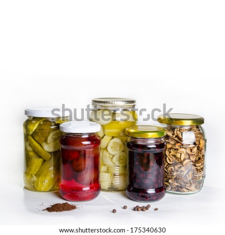 Group of homemade preserves canned goods in mason jars