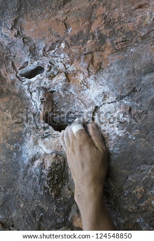 Climbing hand closeup grip during rock climbing