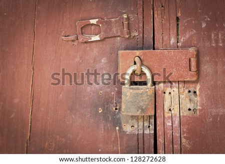 Old master key on brown wood door