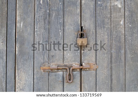 Old master key on wood door