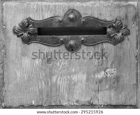 Similar – Image, Stock Photo old, pasted mailbox slot with a flap that says “LETTERS”, made of metal in an old wooden door, where the brown paint is peeling off / write letter / e-mail / mailbox company