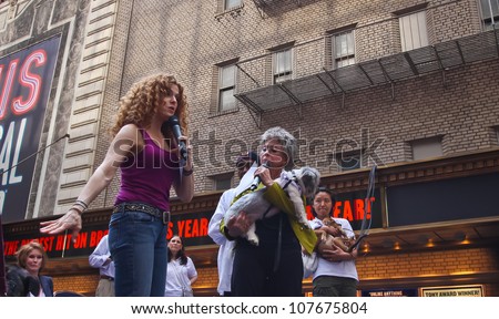 NEW YORK CITY - 14 JULY 2012: Broadway Barks marks its 14th year with a celebrity-studded adoption fair in Shubert Alley. Bernadette Peters & Rita Moreno with friend on 14 July 2012 in New York City.